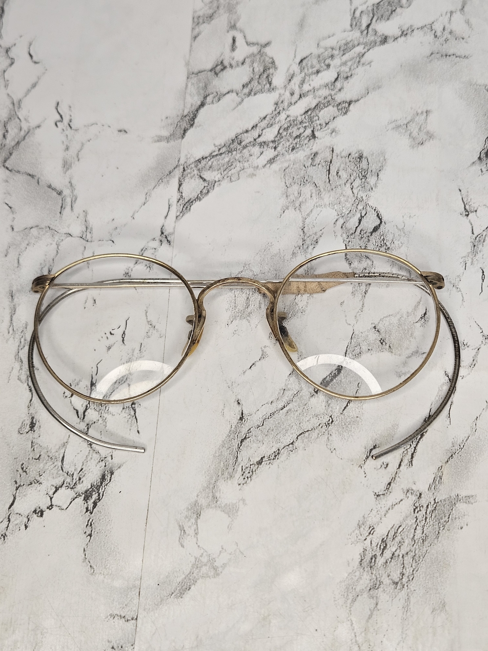 vintage 1/10 12K gold-filled wire-rimmed eyeglasses, likely from the 1930s